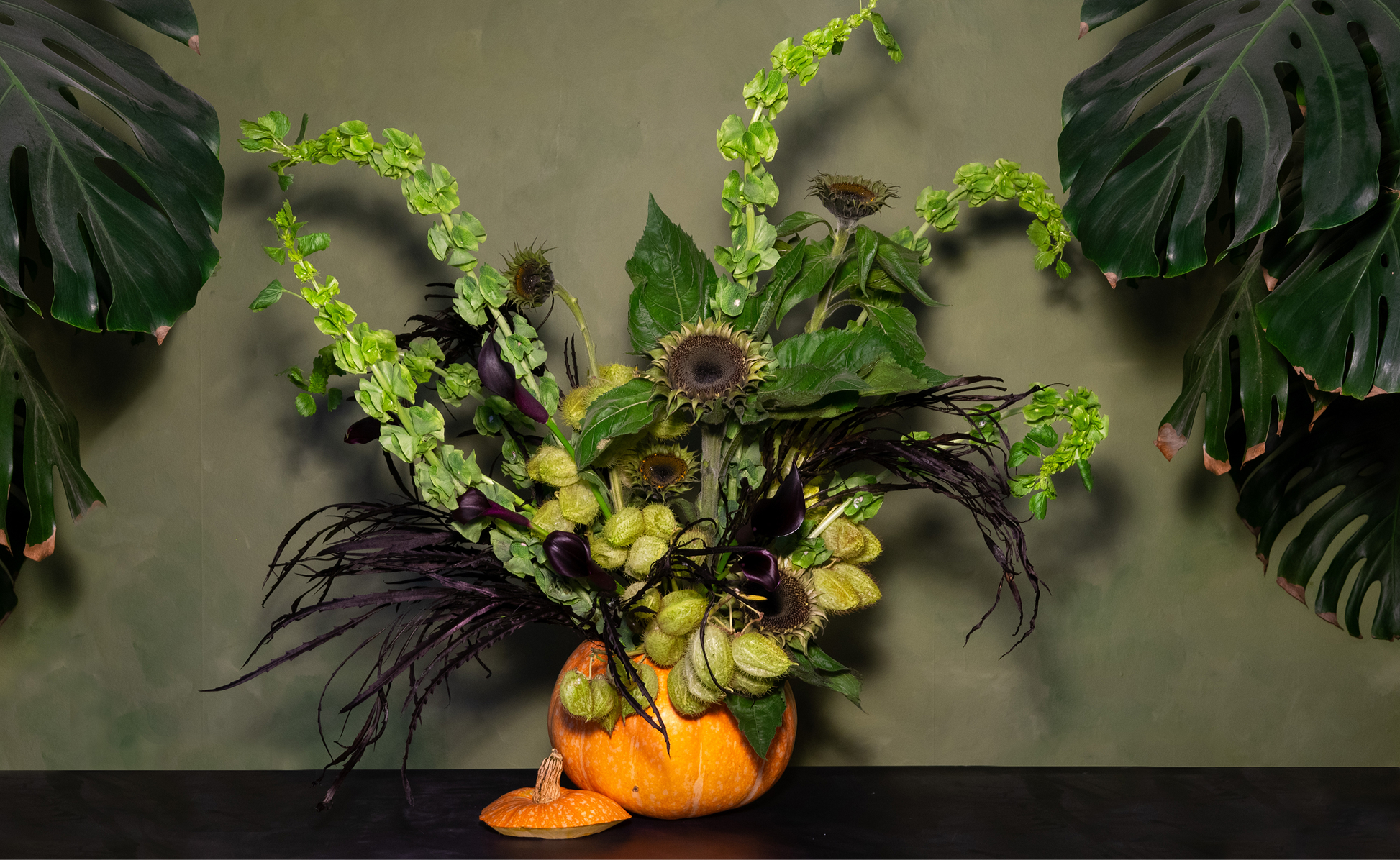 Festive wreath and pumpkin display